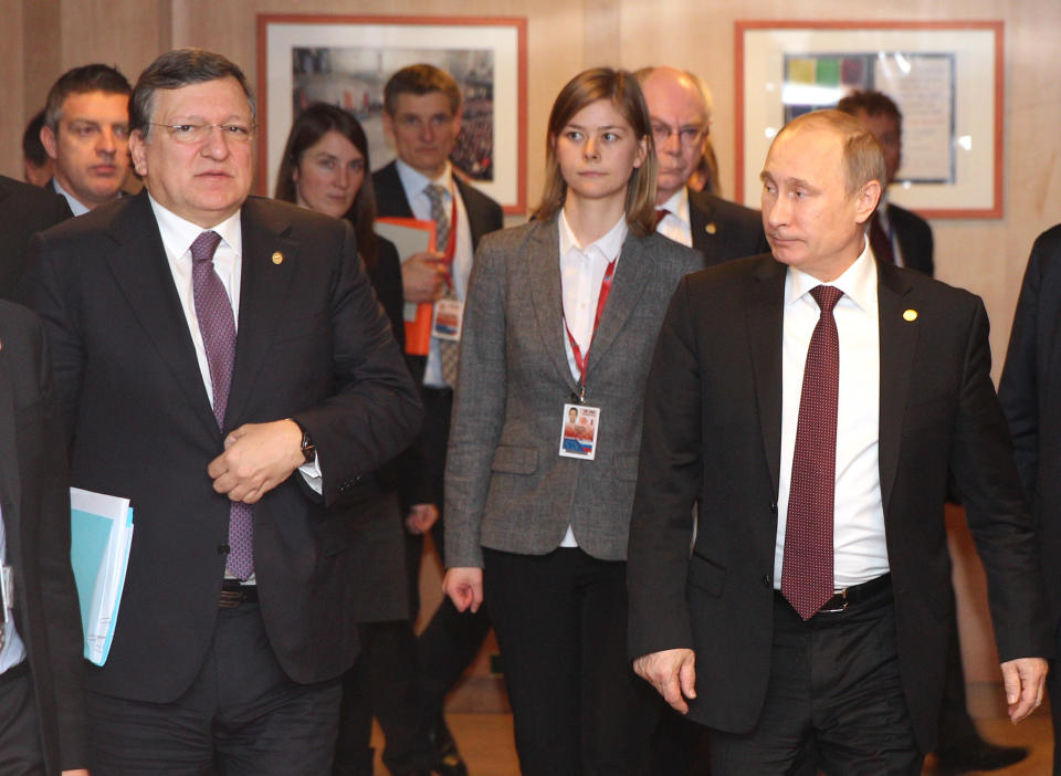 Russian President Vladimir Putin, right, European Council President Herman Van Rompuy, center back, and European Commission President Jose Manuel Barroso, walk towards a meeting room, at the European Council building in Brussels on Tuesday, Jan. 28, 2014. Russian President Vladimir Putin and European Union leaders are weighing the future of their common relationship at a summit that was abridged amid stark differences over Ukraine's future and other issues. (AP Photo/Yves Logghe, pool)