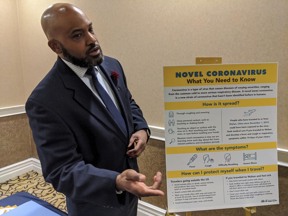 Dr. Muntu Davis, MD, MPH, Los Angeles County Health Office, right, briefs the media on Coronavirus in San Gabriel, Calif., Friday, Jan. 31, 2020, as the outbreak reaches Southern California. (AP Photo/Damian Dovarganes)