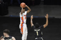 Florida's Tyree Appleby makes a basket over Army's Jalen Rucker in the second half of an NCAA college basketball game, Wednesday, Dec. 2, 2020, in Uncasville, Conn. (AP Photo/Jessica Hill)