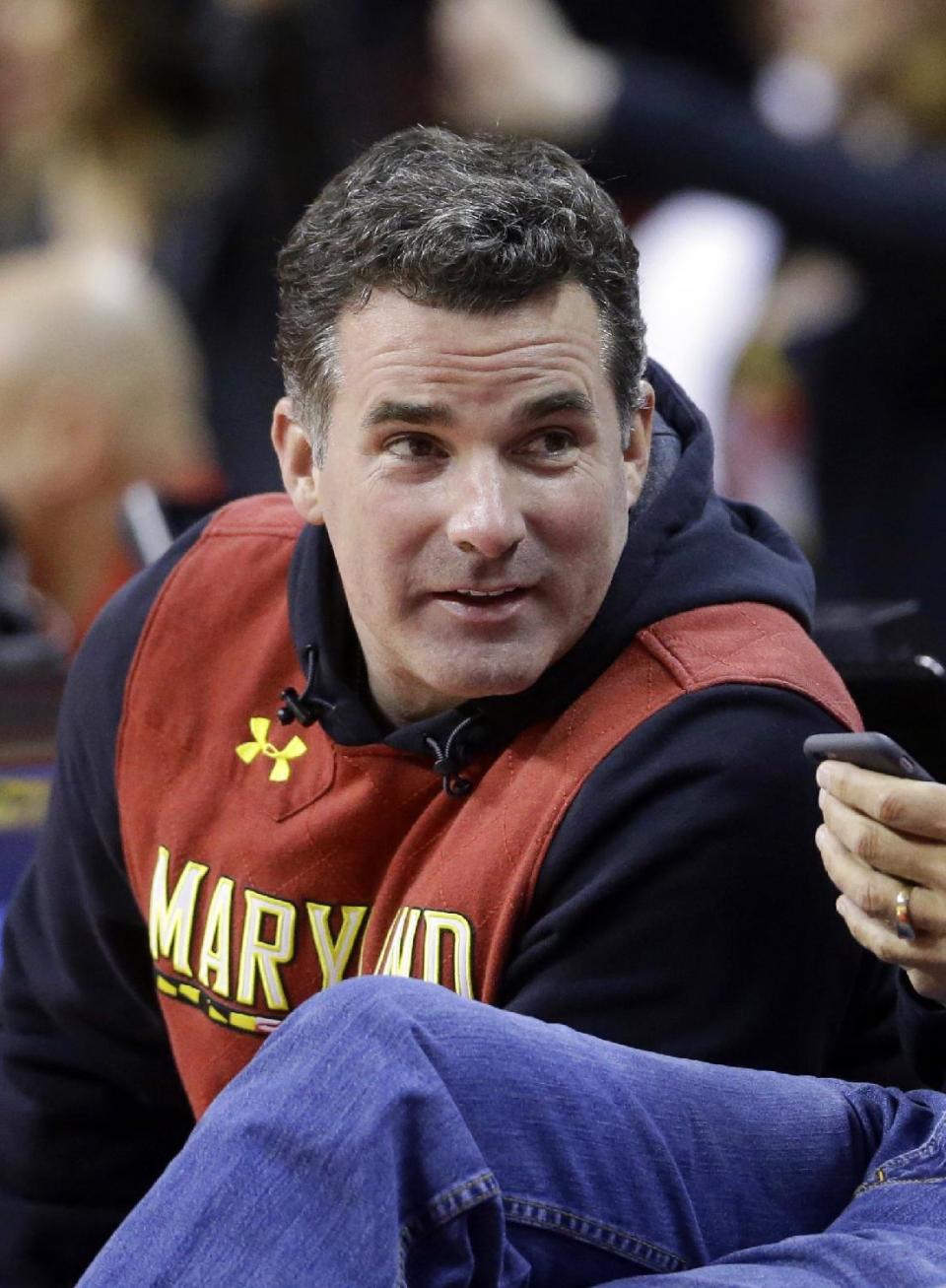 In this Saturday, Jan. 17, 2015 photo, Under Armour founder Kevin Plank sits courtside during the second half of an NCAA college basketball game between Maryland and Michigan State, in College Park, Md. Plank, is responding to criticism he received after calling President Donald Trump "an asset to the country." Plank wrote an open letter to Baltimore published as a full-page advertisement in The Baltimore Sun Wednesday, Feb. 15, 2017. (AP Photo/Patrick Semansky)