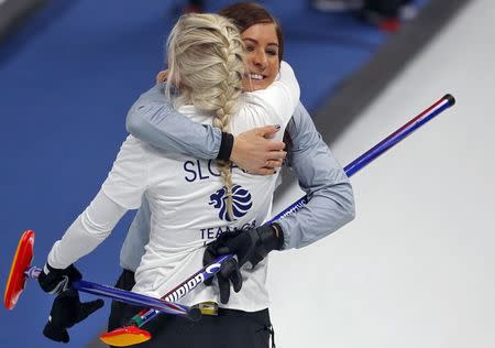 Curling - Pyeongchang 2018 Winter Olympics - Women's Round Robin - Britain v Canada - Gangneung Curling Center - Gangneung, South Korea - February 21, 2018 -Eve Muirhead and Anna Sloan of Britain celebrate after beating Canada. REUTERS/Phil Noble