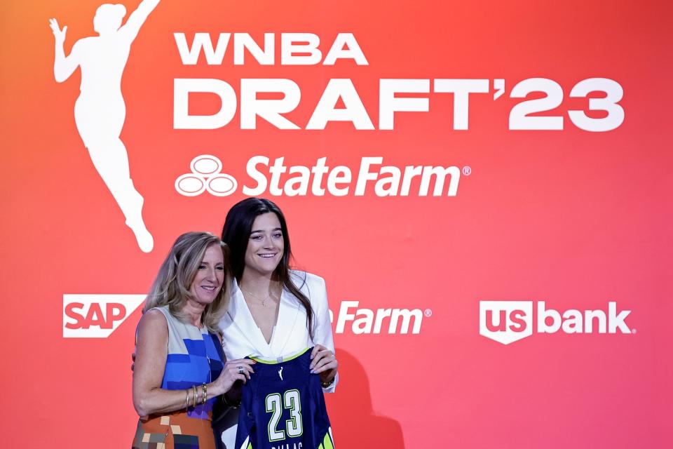 Villanova's Maddy Siegrist, right, poses for a photo with commissioner Cathy Engelbert after being selected by the Dallas Wings at the WNBA basketball draft Monday, April 10, 2023, in New York. (AP Photo/Adam Hunger)