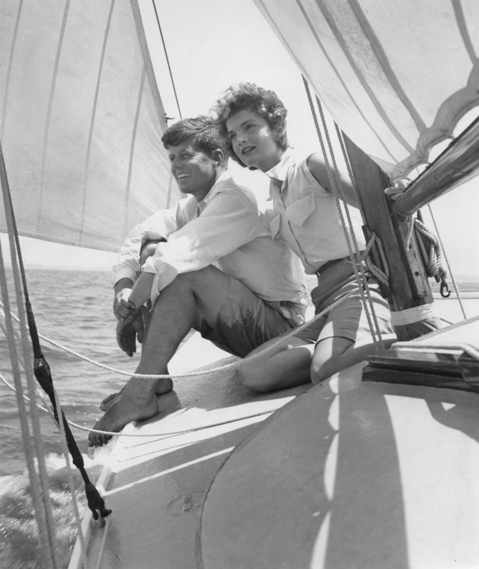 HYANNIS PORT, MA  - JUNE 1953:  Senator John F. Kennedy and fiance Jacqueline Bouvier go sailing while on vacation at the Kennedy compound in June 1953 in Hyannis Port, Massachusetts. (Photo by Hy Peskin/Getty Images) 