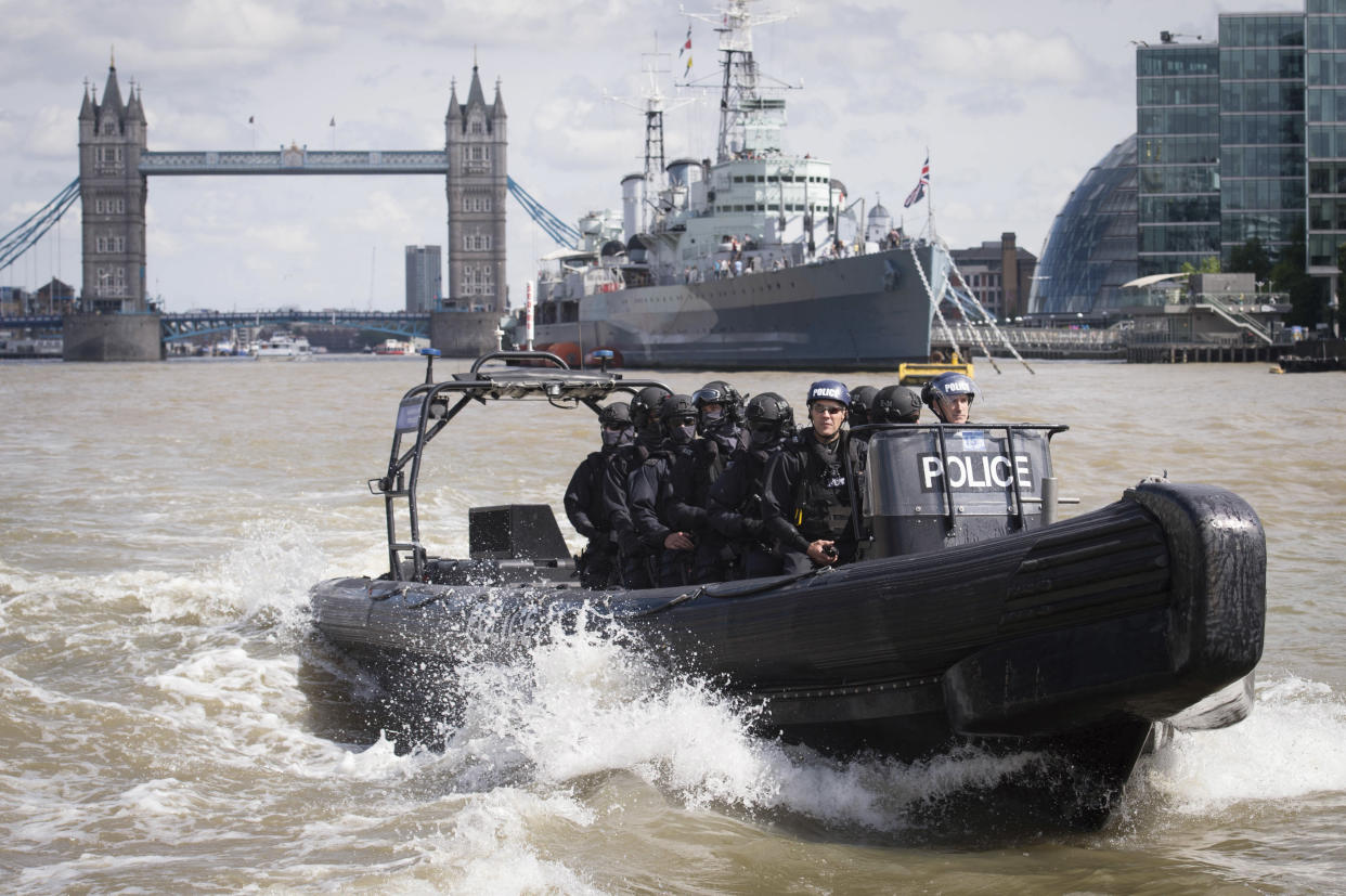 Armed Metropolitan Police counter terrorism officers take part in an exercise on the River Thames in London (Picture: Reuters)