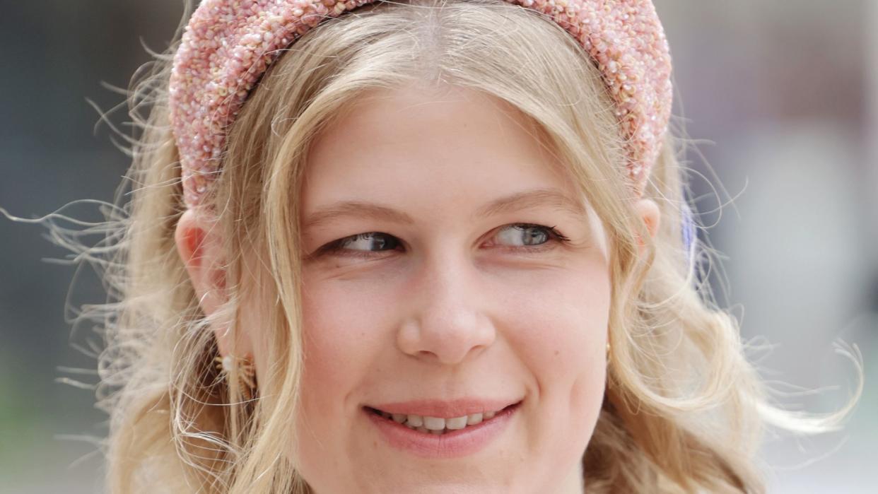 Lady Louise Windsor in a white dress and pink hairband