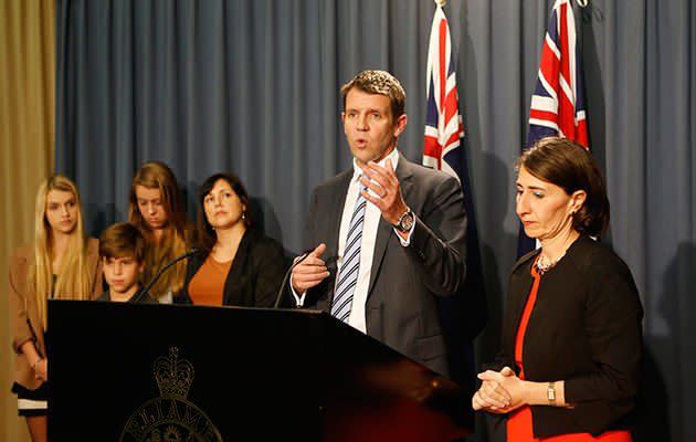 NSW Premier-elect Mike Baird accompanied by his family and Deputy Gladys Berejiklian during a press conference at NSW Parliament. Photo: AAP