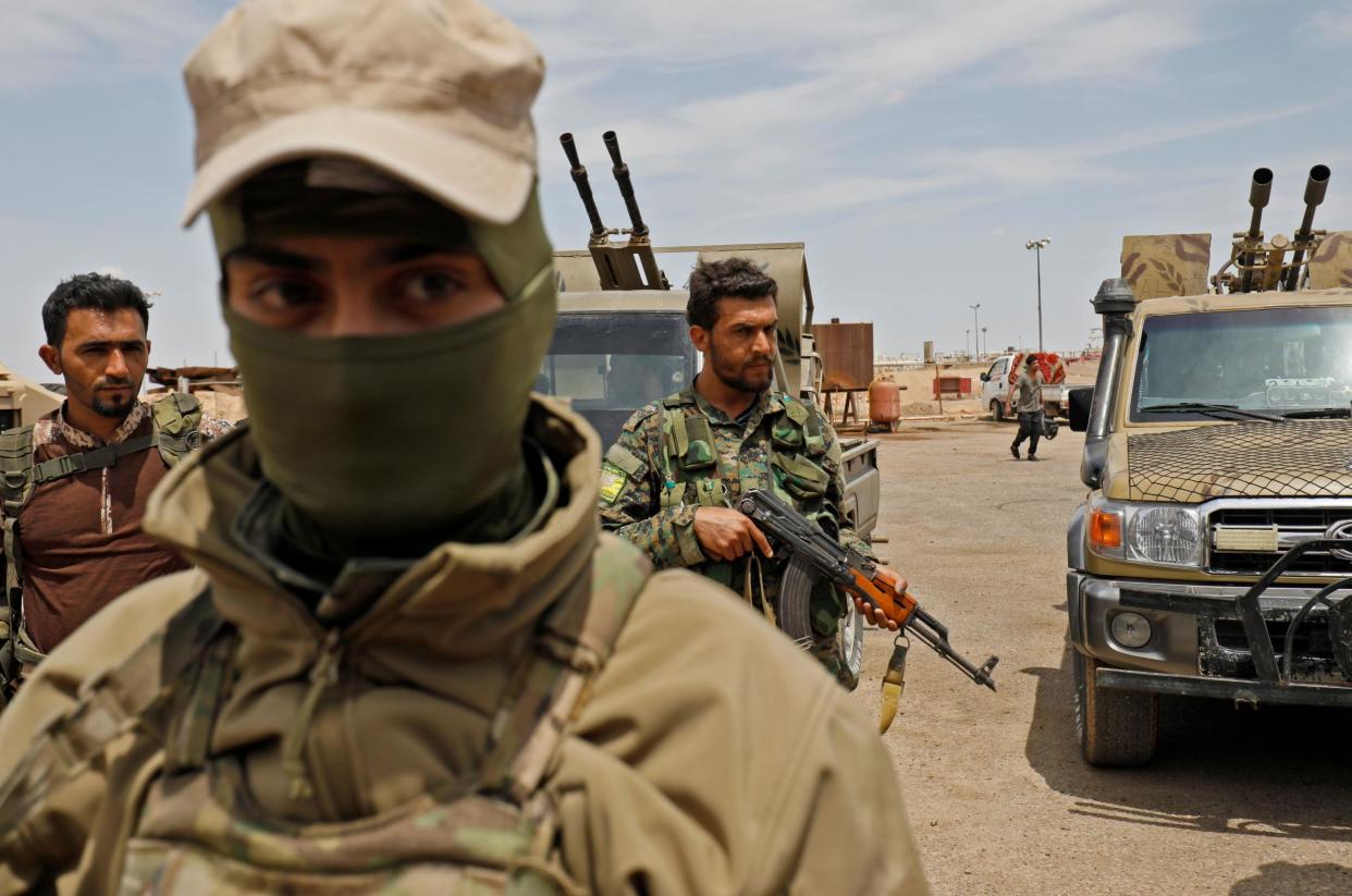 Members of the Syrian Democratic Forces (SDF) outside Al Bukamal as they prepare to relaunch a military campaign against Isis on 1 May, 2018: AFP/Getty