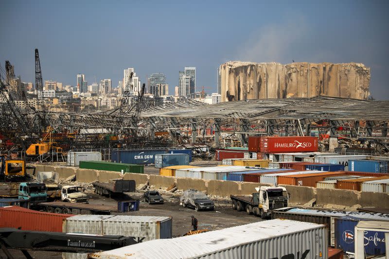 FILE PHOTO: A man makes his way in the damaged port, following a massive explosion, in Beirut