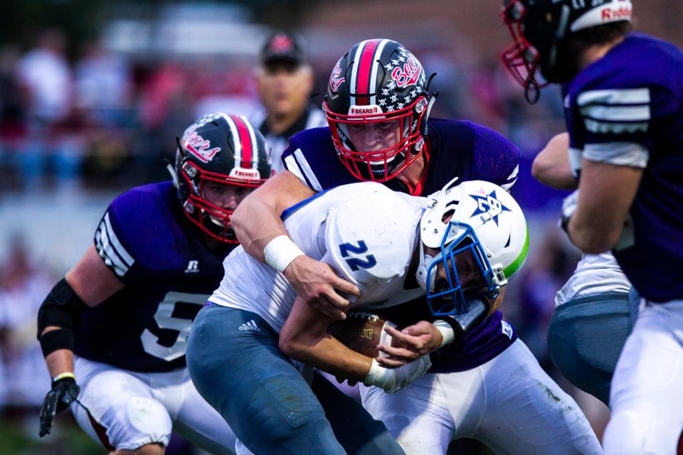 West Branch's Jeff Bowie (62) tackles Bellevue's Jacob Waller (22) during a Class 1A varsity football game, Thursday, Sept., 26, 2019, at the Little Rose Bowl in West Branch, Iowa.