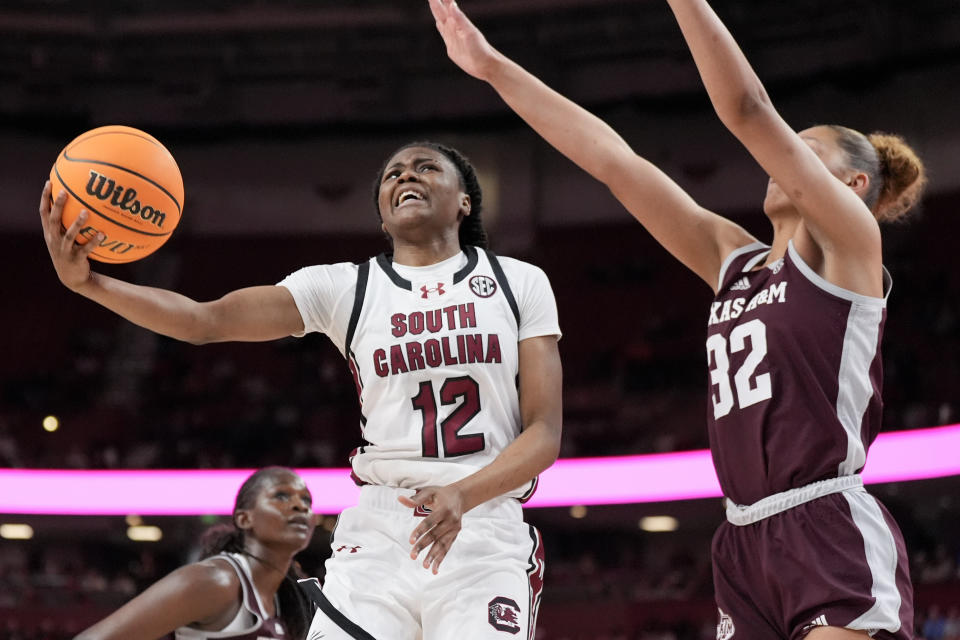 South Carolina guard MiLaysia Fulwiley shoots around Texas A&M forward Lauren Ware during the second half of an NCAA college basketball game at the Southeastern Conference women's tournament Friday, March 8, 2024, in Greenville, S.C. (AP Photo/Chris Carlson)