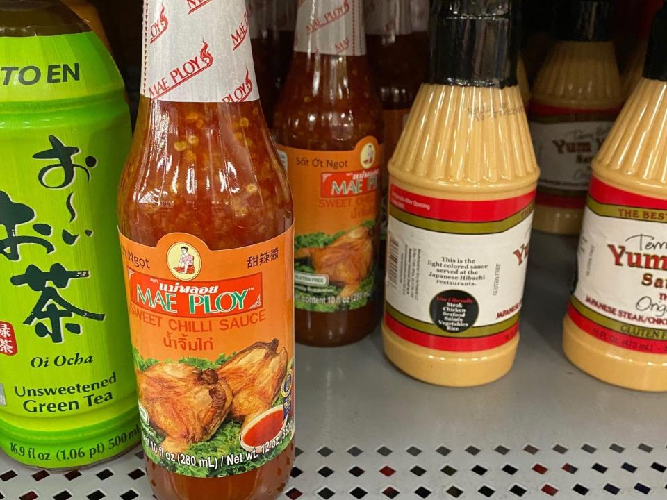 bottles of asian inspired condiments on the shelves at walmart