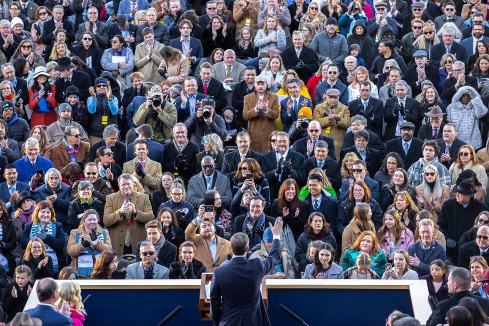 Kentucky Gov. Andy Beshear waves to the crowd before taking the oath of office outside the state Capitol in Frankfort, Ky., on Tuesday, Dec. 12, 2023. Ryan C. Hermens/rhermens@herald-leader.com