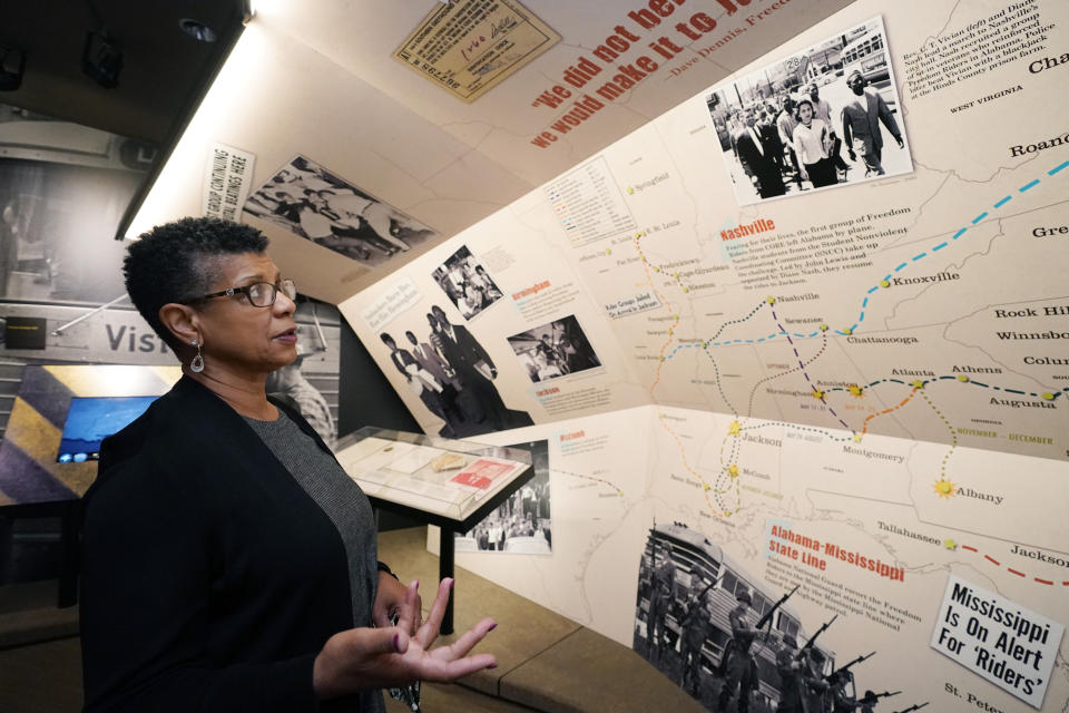 Denise Morse reacts to a 1960s photograph of her father, the late C.T. Vivian, leading a march in Nashville, Tenn., on Wednesday, May 26, 2021, at the Mississippi Civil Rights Museum in Jackson, Miss. Vivian was among the activists arrested in Jackson in May 1961 after they challenged segregation as Freedom Riders. Vivian was awarded the Presidential Medal of Freedom in 2013, and he died in July 2020 in Atlanta. Jackson's current mayor declared Wednesday as C.T. Vivian Day in Mississippi's capital city. (AP Photo/Rogelio V. Solis)