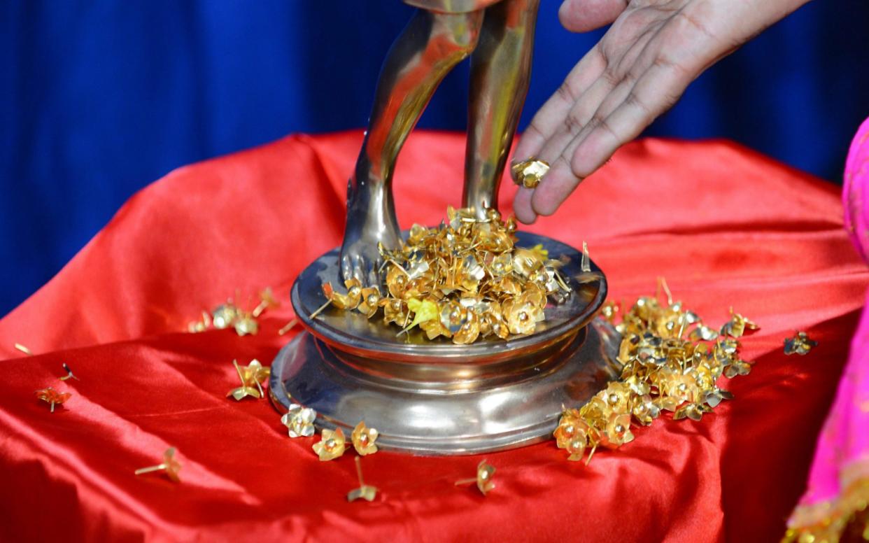 More than 1,200 temples across India will pawn their gold to make financial ends meet - SAM PANTHAKY /AFP