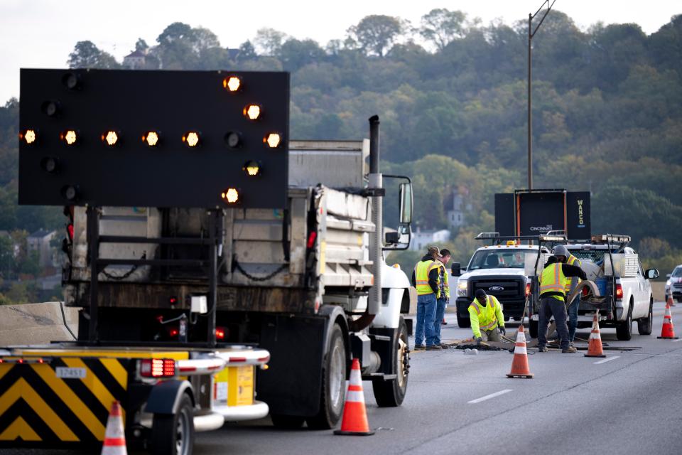 The Cincinnati Department of Transportation & Engineering sent workers to make repairs on the Western Hills Viaduct on Oct. 18, after concrete fell from the top to the bottom deck of the 91-year-old structure.