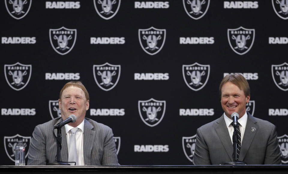 Oakland Raiders head coach Jon Gruden, right, and owner Mark Davis answer questions when Gruden was announced as coach. (AP)