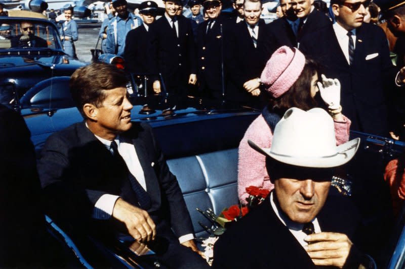 From left to right, President John F. Kennedy, first lady Jackie Kennedy and Texas Gov. John Connally begin the motorcade in Dallas just before the president was assassinated. UPI File Photo