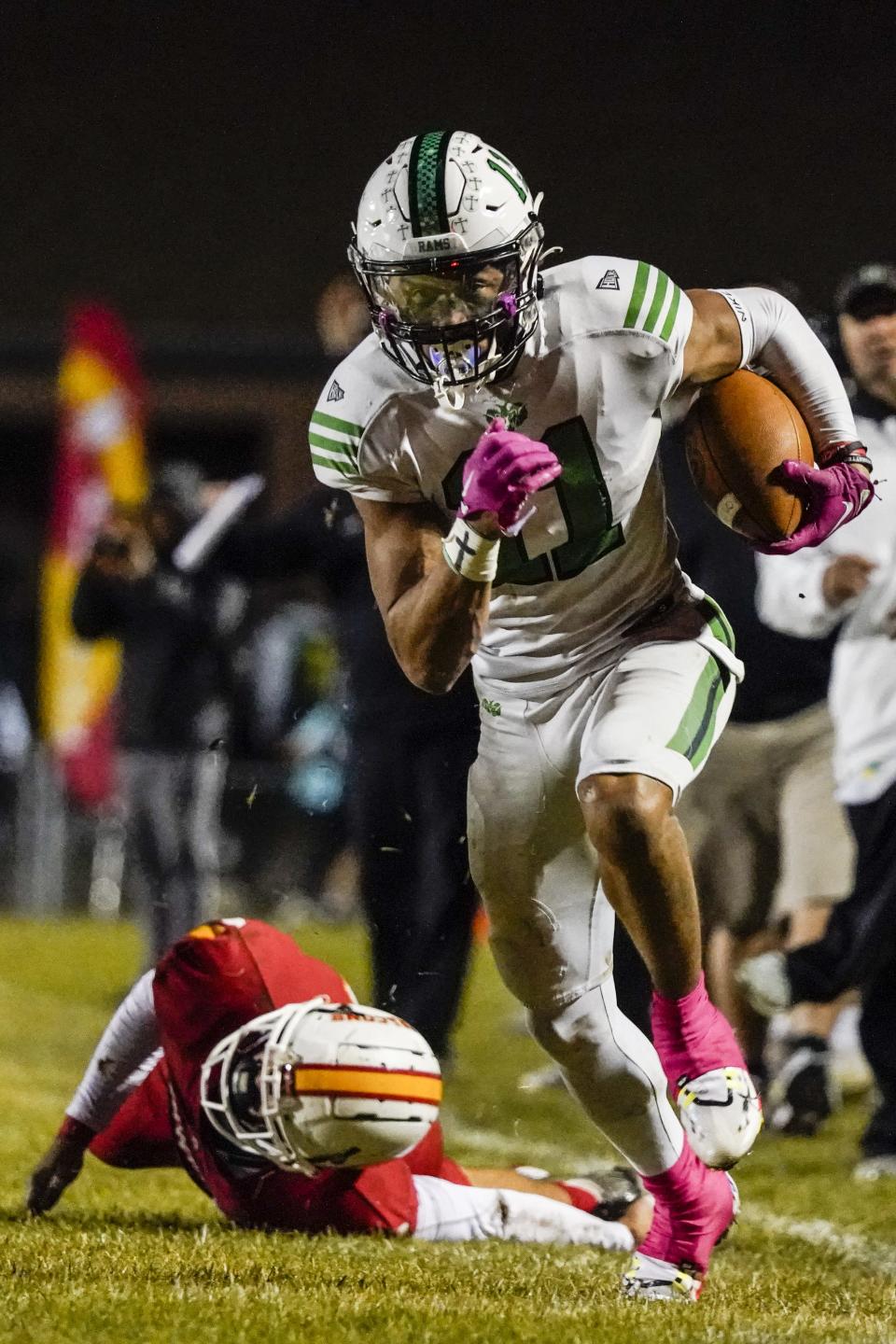 Badin wide receiver Braedyn Moore (11) breaks a tackle and races to the end zone for a touchdown during the second half of their high school football game with Fenwick Friday, Oct. 14.