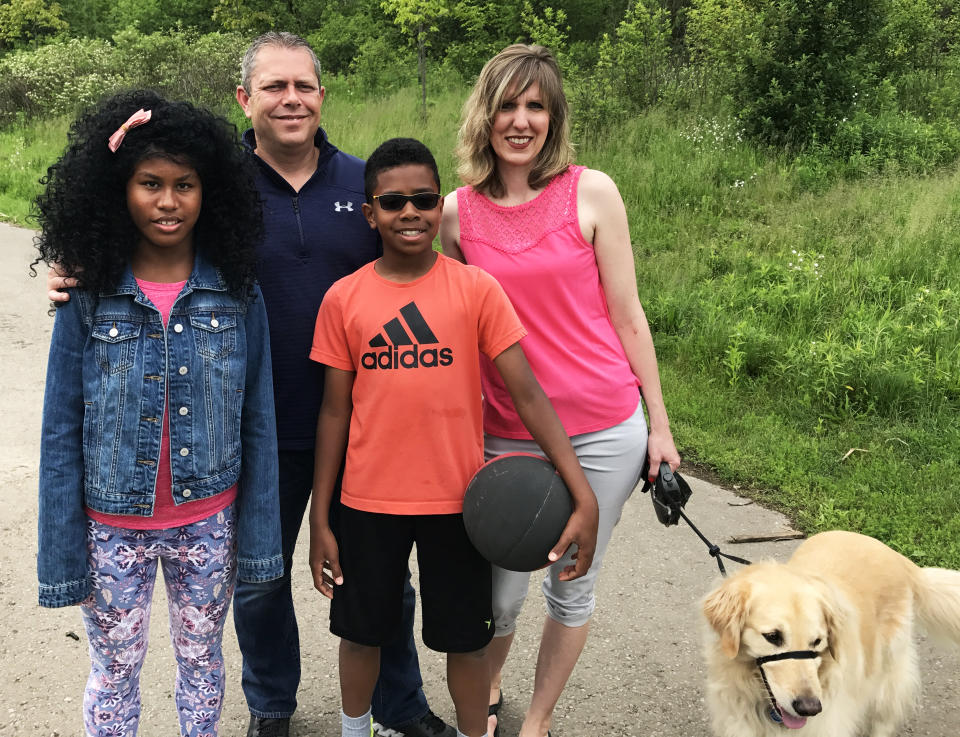 Liz LeBrun (right) with her children, adopted siblings Maria and Andy, and her husband. (Dave Thomas Foundation for Adoption)