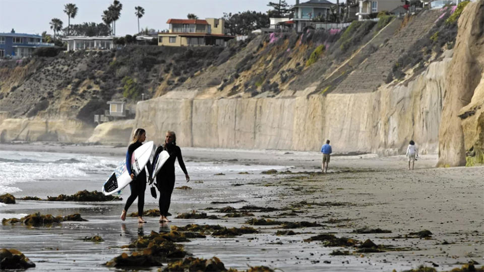 Seawalls like these, in Solana Beach, Calif., are a point of contention in coastal communities because they prevent bluffs from eroding—but also diminish beaches.