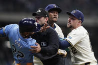 Tampa Bay Rays' Jose Siri (22) fights with Milwaukee Brewers' Abner Uribe, middle, during the eighth inning of a baseball game Tuesday, April 30, 2024, in Milwaukee. (AP Photo/Aaron Gash)