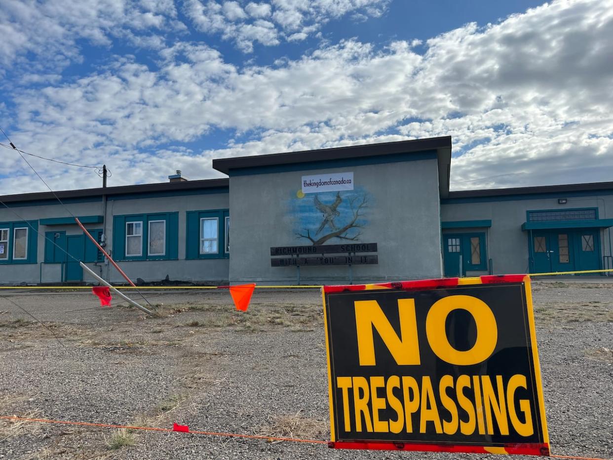 Romana Didulo and her cult made their way to the village of Richmound, Sask., on Sept. 15, and have been staying at the former Richmound School after being invited by the property owner. It is blocked off to the public. (CBC - image credit)