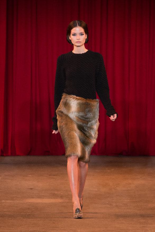 In this photo provided by Christian Siriano a model walks the runway during the Christian Siriano Fall 2013 fashion show during Fashion Week, Saturday, Feb. 9 2013, in New York. (AP Photo/Christian Siriano)