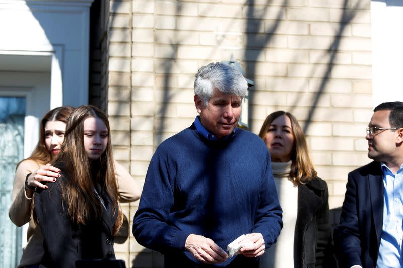 Rod Blagojevich stands with his family outside his home after U.S. President Donald Trump commuted his prison sentence, in Chicago
