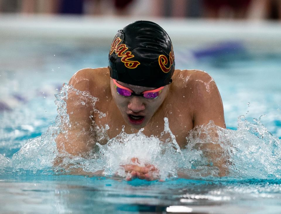 North's Hunter Tang swims the Boy's 100 Yard Breaststroke race during the 2024 Counsilman Classic Swimming & Diving Meet between the Bloomington North Cougars and Bloomington South Panthers at Bloomington High School South Natatorium on January 13, 2024