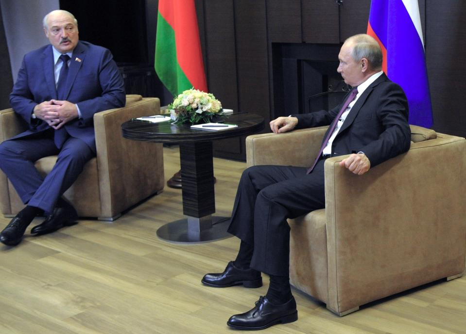 Russian President Vladimir Putin, right, and Belarusian President Alexander Lukashenko talk during their meeting in the Black Sea resort of Sochi, Russia, Friday, May 28, 2021. (Mikhail Klimentyev, Sputnik, Kremlin Pool Photo via AP)