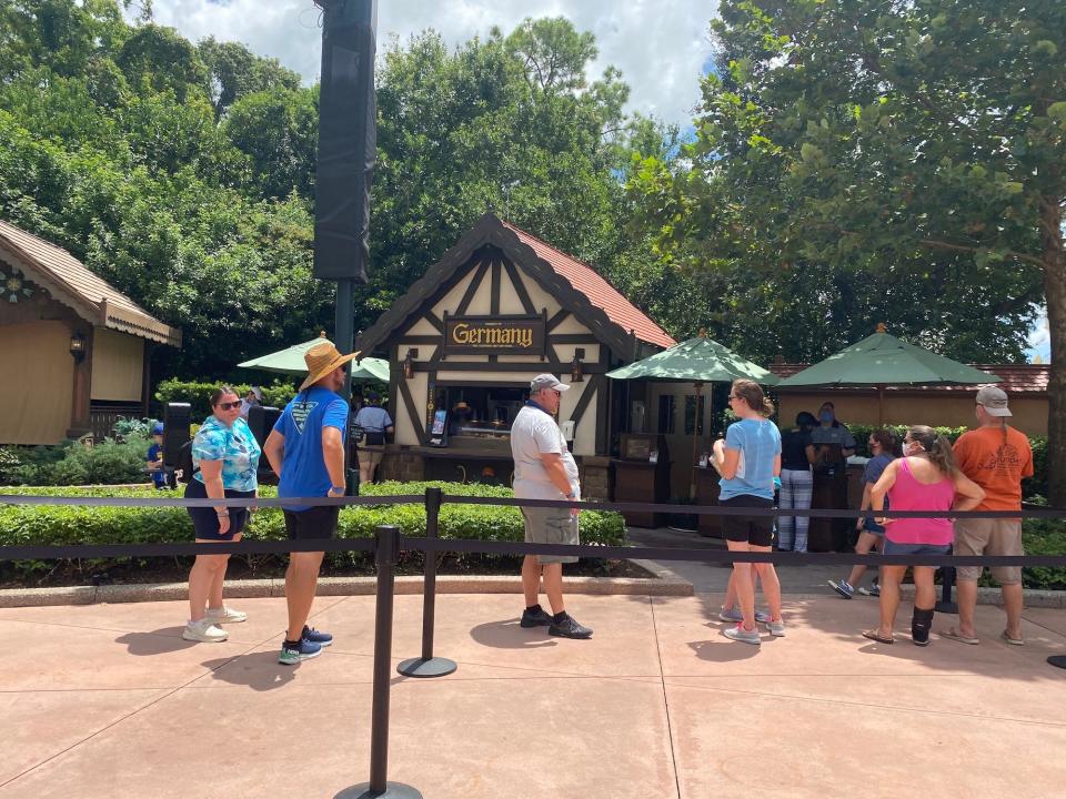 People wait in line to order from the Germany booth at the 2021 International Food & Wine Festival.