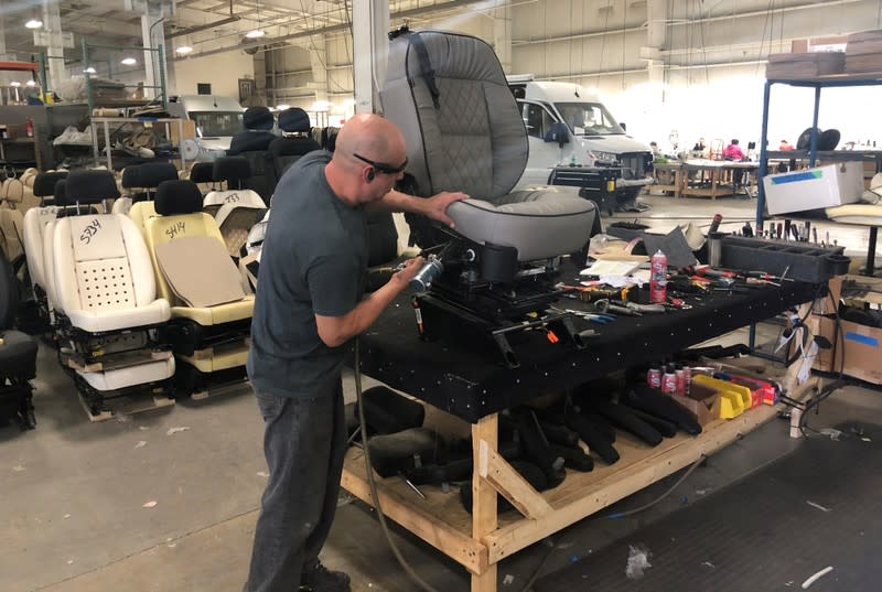 FILE PHOTO: An assembly line worker works on the production line at Midwest Automotive Designs in Bristol, Indiana