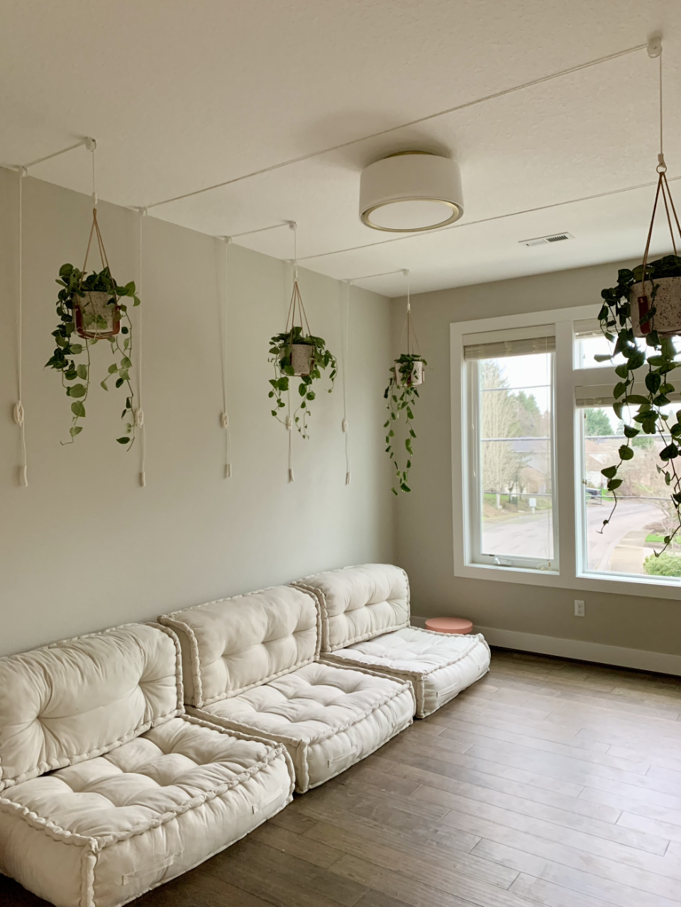 a living space with a white couch and a white table