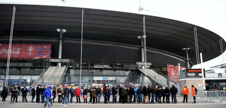 Spectators wait before a security check-point outside the Stade-de-France stadium in Saint-Denis, north of Paris, on February 6, 2016, prior to the Six Nations international rugby union match between France and Italy