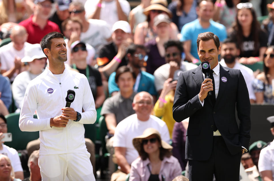 Novak Djokovic (pictured left) stands next to Roger Federer (pictured right) during a Wimbledon ceremony.