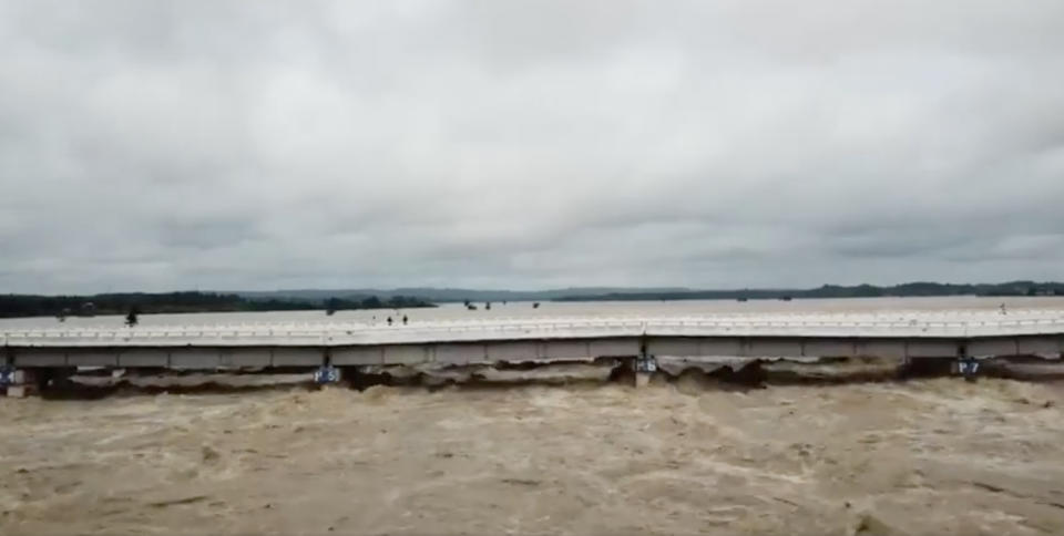 <p>A bridge is seen after a dam breach flooded the area in Swar township, Myanmar, Aug. 29, 2018, in this still image from video obtained from social media. (Photo: ASHIN KAW WIDA/via Rreuters) </p>