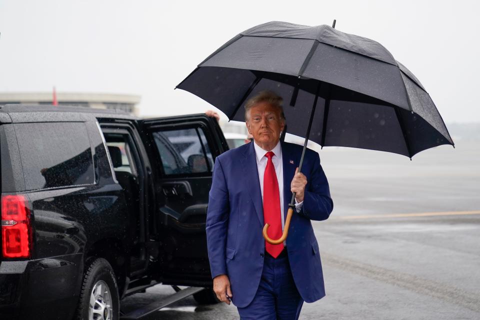 Former President Donald Trump walks to speak with reporters before he boards his plane at Ronald Reagan Washington National Airport, Thursday, Aug. 3, 2023, in Arlington, Va., after facing a judge on federal conspiracy charges that allege he conspired to subvert the 2020 election.