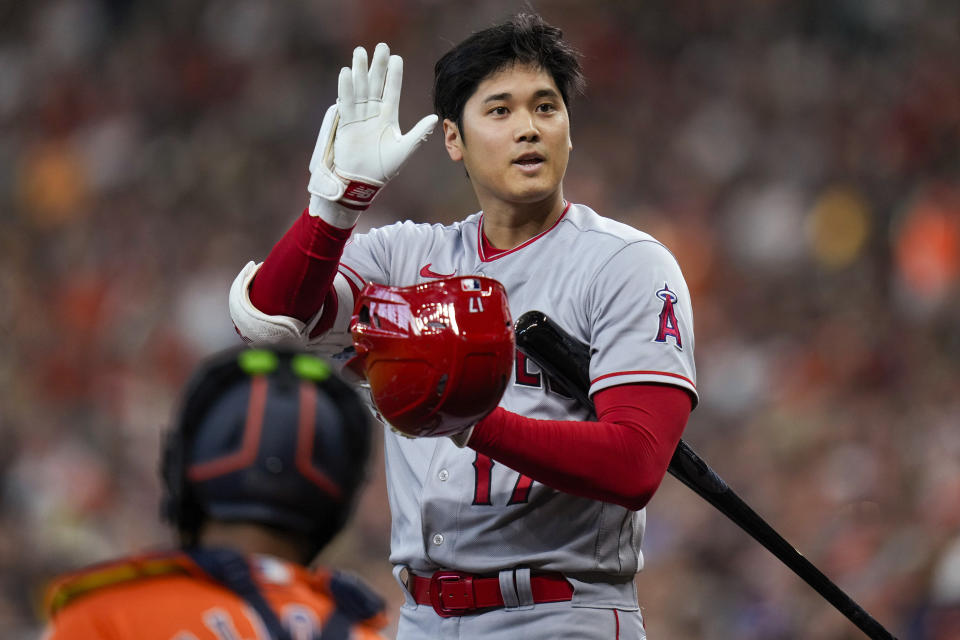 Los Angeles Angels designated hitter Shohei Ohtani asks for a timeout during the first inning of the team's baseball game against the Houston Astros, Friday, Aug. 11, 2023, in Houston. (AP Photo/Eric Christian Smith)