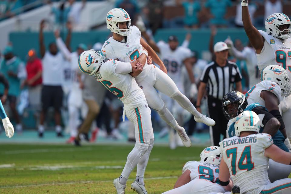 Sep 8, 2024; Miami Gardens, Florida, USA; Miami Dolphins punter Jake Bailey (16) lifts Miami Dolphins place kicker Jason Sanders (7) after his game winning field goal against the Jacksonville Jaguars at Hard Rock Stadium. Mandatory Credit: Jim Rassol-Imagn Images