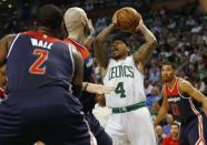 Apr 30, 2017; Boston, MA, USA; Boston Celtics guard Isaiah Thomas (4) looks to pass past Washington Wizards center Marcin Gortat (13) and guard John Wall (2) during the second half of the Boston Celtics 123-111 win over the Washington Wizards in game one of the second round of the 2017 NBA Playoffs at TD Garden. Mandatory Credit: Winslow Townson-USA TODAY Sports