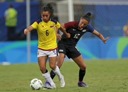 2016 Rio Olympics - Soccer - Preliminary - Women's First Round - Group G Colombia v USA - Amazonia Stadium - Manaus, Brazil - 09/08/2016. Liana Salazar (COL) of Colombia and Christen Press (USA) of USA in action. REUTERS/Bruno Kelly