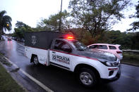 A police vehicle used to carry bodies leave at the community where a plane crashed in Vinhedo, Sao Paulo state, Brazil, Saturday, Aug. 10, 2024. (AP Photo/Andre Penner)