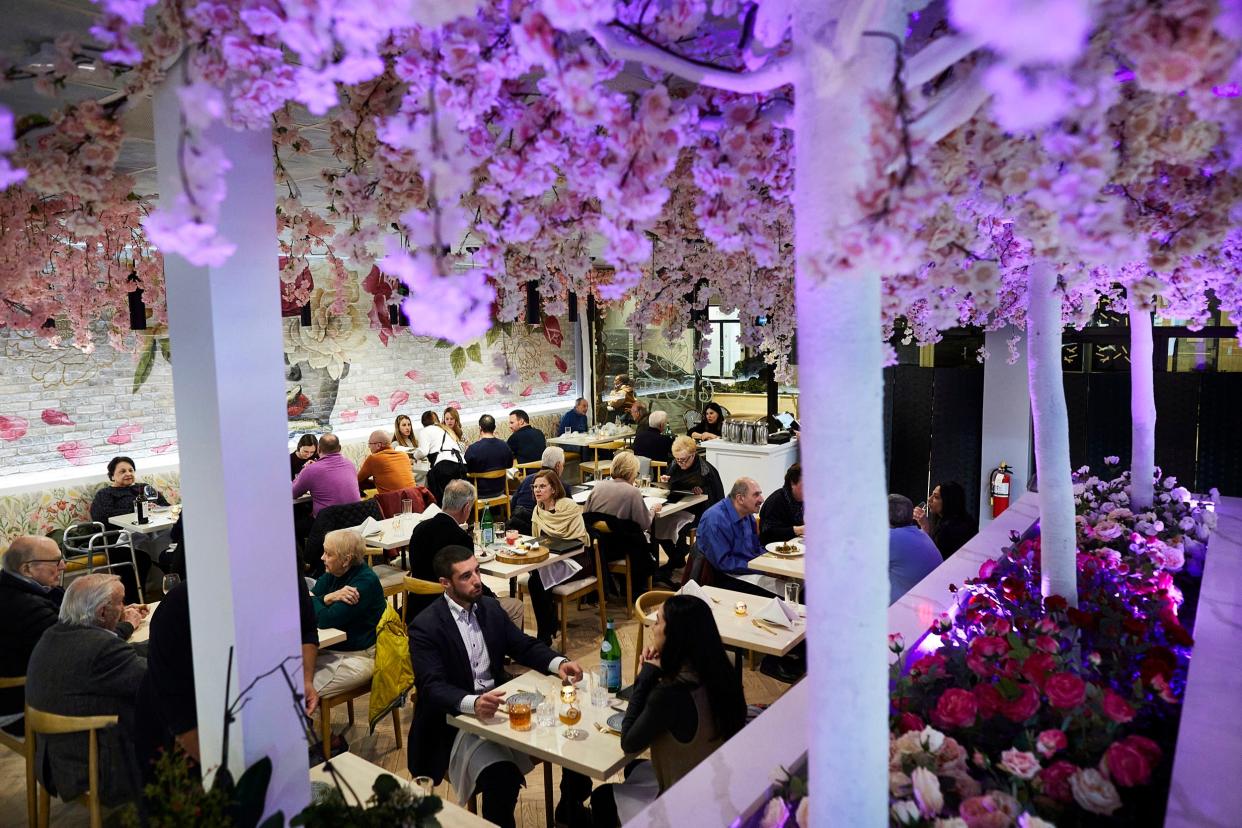 Saturday night diners in the flowered dining room at The Grove photographed in Potomac, Maryland