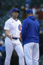 Chicago Cubs closing pitcher Jason Adam left, celebrates with manager David Ross right, after defeating the Atlanta Braves in a Major League baseball game Saturday, April 17, 2021, in Chicago. (AP Photo/Paul Beaty)