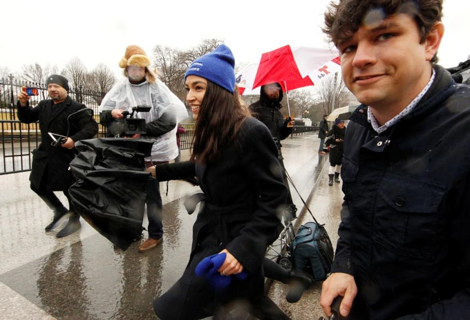 <div class="inline-image__caption"><p>Rep. Alexandria Ocasio-Cortez (D-NY) walks away with her then Communications Director Corbin Trent (R).</p></div> <div class="inline-image__credit">Jim Bourg/Reuters</div>