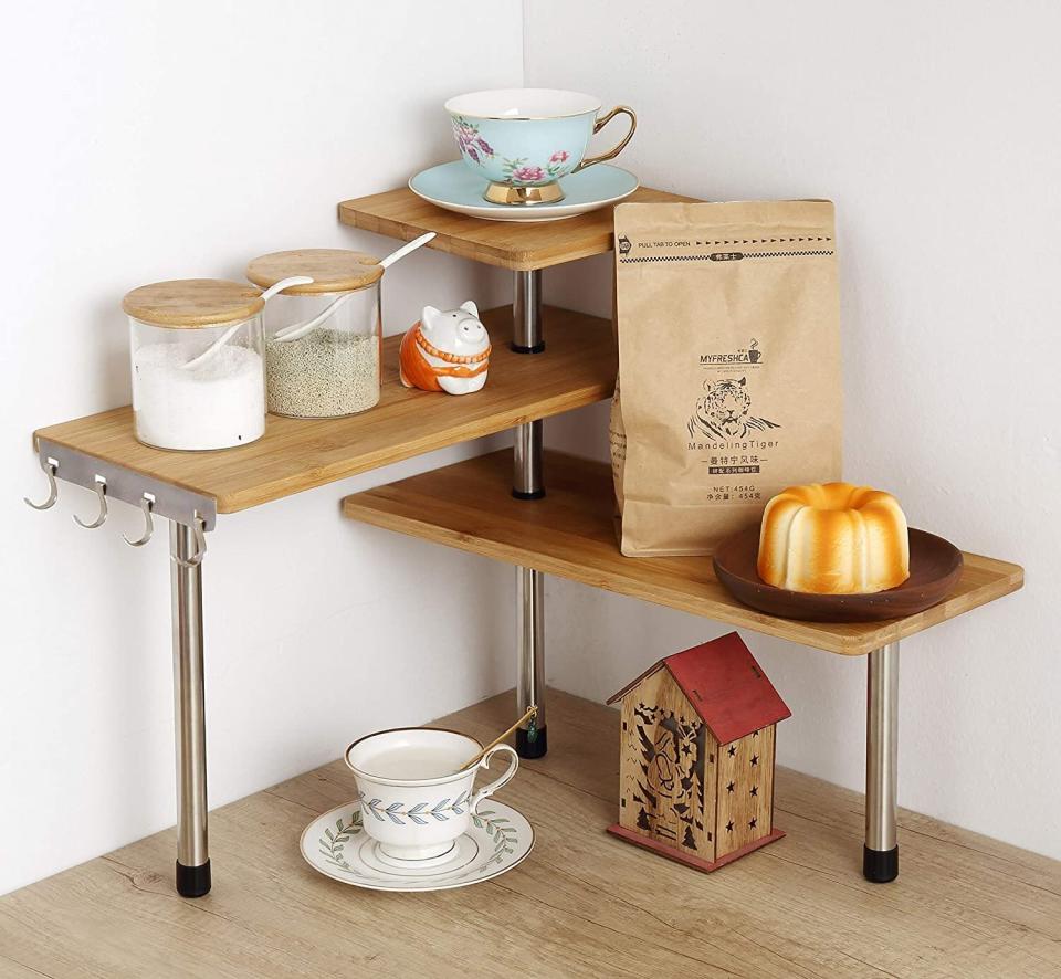 This <a href="https://amzn.to/3ox9tzn" target="_blank" rel="noopener noreferrer">three-tier organizer</a> is perfect for awkward corner countertops where it's easy to underutilize the space. Use this to store mugs and plates, coffee and tea accessories or to display cookbooks. <a href="https://amzn.to/3ox9tzn" target="_blank" rel="noopener noreferrer">Get it for $30 on Amazon</a>.