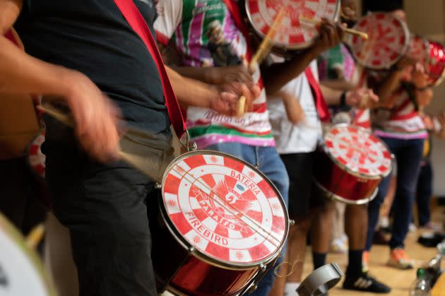 Paraiso School of Samba's Bateria accompanies Samba dancers as they rehearse ahead of the Notting Hill Carnival. (Photo: Clara Watt for HuffPost)