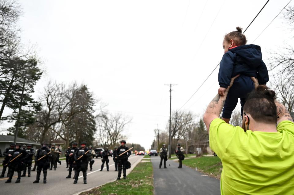 Damik Wright, brother of Daunte Wright, holds Daunte’s son during Sunday protestAaron Lavinsky/Star Tribune via AP