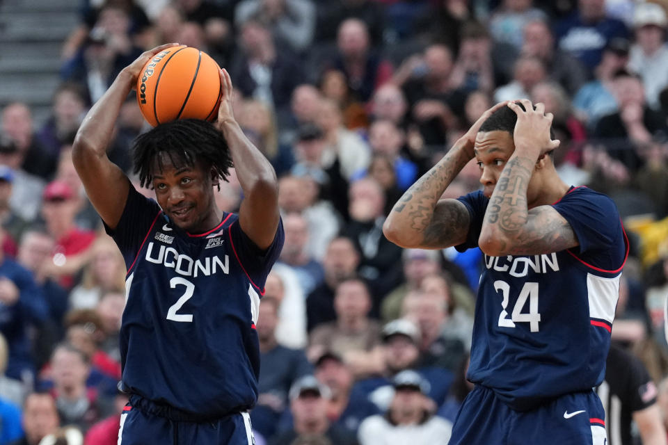 Connecticut's Tristen Newton (2) and Jordan Hawkins (24) react during a game against Gonzaga on March 25. (Joe Camporeale-USA TODAY Sports)