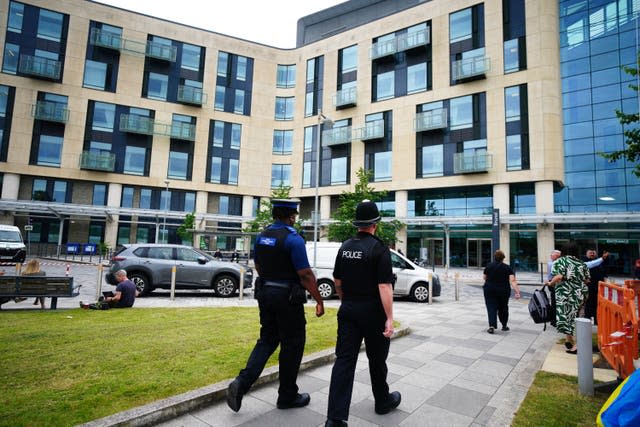 Police walking outside Southmead Hospital